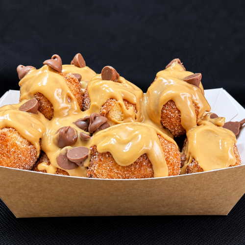 Sugary donut balls with peanut butter drizzle