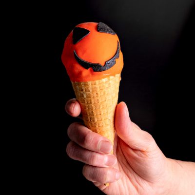 MR PUMPKIN HEAD - Waffle cone filled with cheesecake mousse, pretzel fudge and baked cheesecake gelato and pretzel crunch, dipped in orange white chocolate